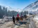 Tourist riding horse in Sonamarg Valley during winter